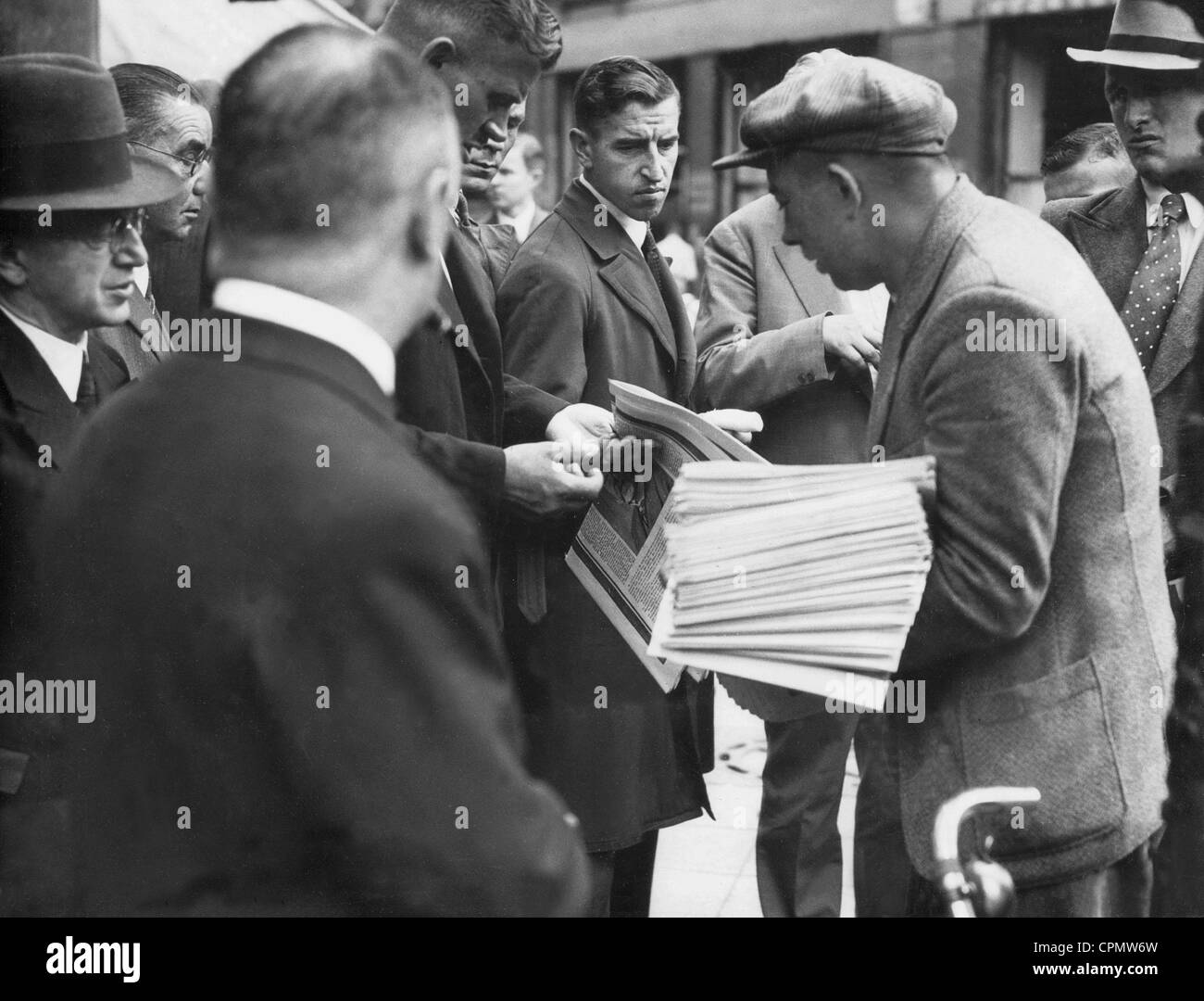 People buy newspapers in Berlin after the death of Reich President von ...