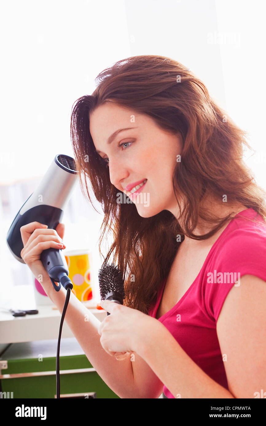 Mature woman hair brush dryer hi-res stock photography and images - Alamy