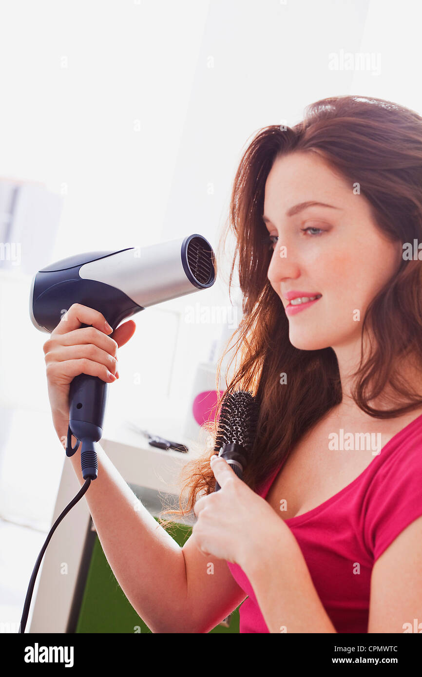 Mature woman hair brush dryer hi-res stock photography and images - Alamy
