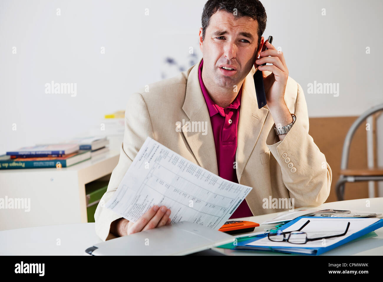 MAN FILLING OUT FORMS Stock Photo - Alamy