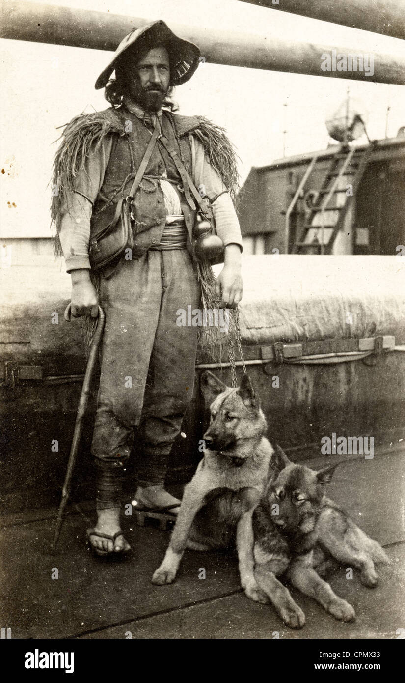 Eccentric Vagabond Traveler on Shipboard with Dogs Stock Photo