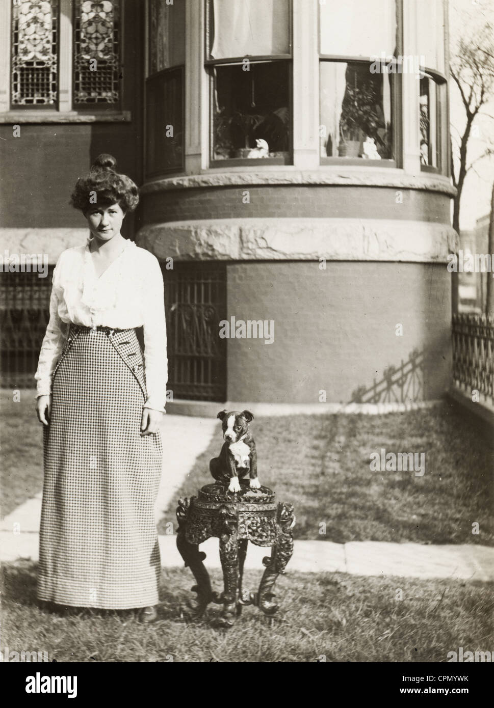 Pretty Young Woman & Tiny Bulldog Puppy Stock Photo