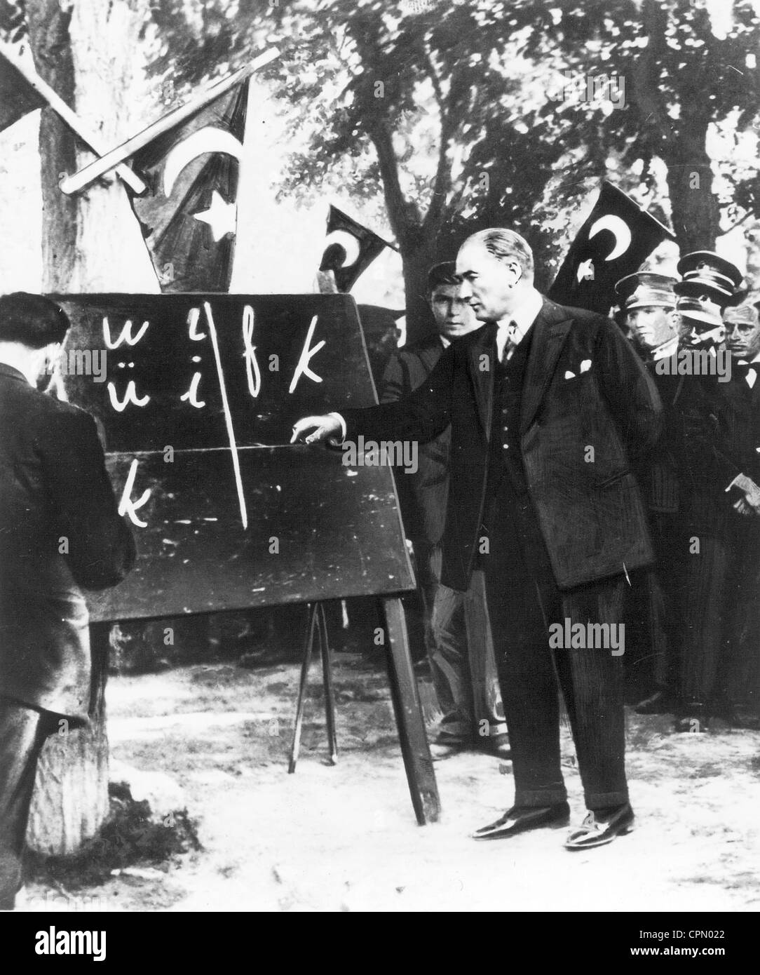 Kamel Ataturk points to Roman letters on a board, 1928 Stock Photo