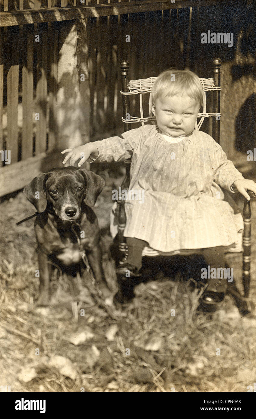 Ugly Little Blonde Girl with Puppy Dog Stock Photo
