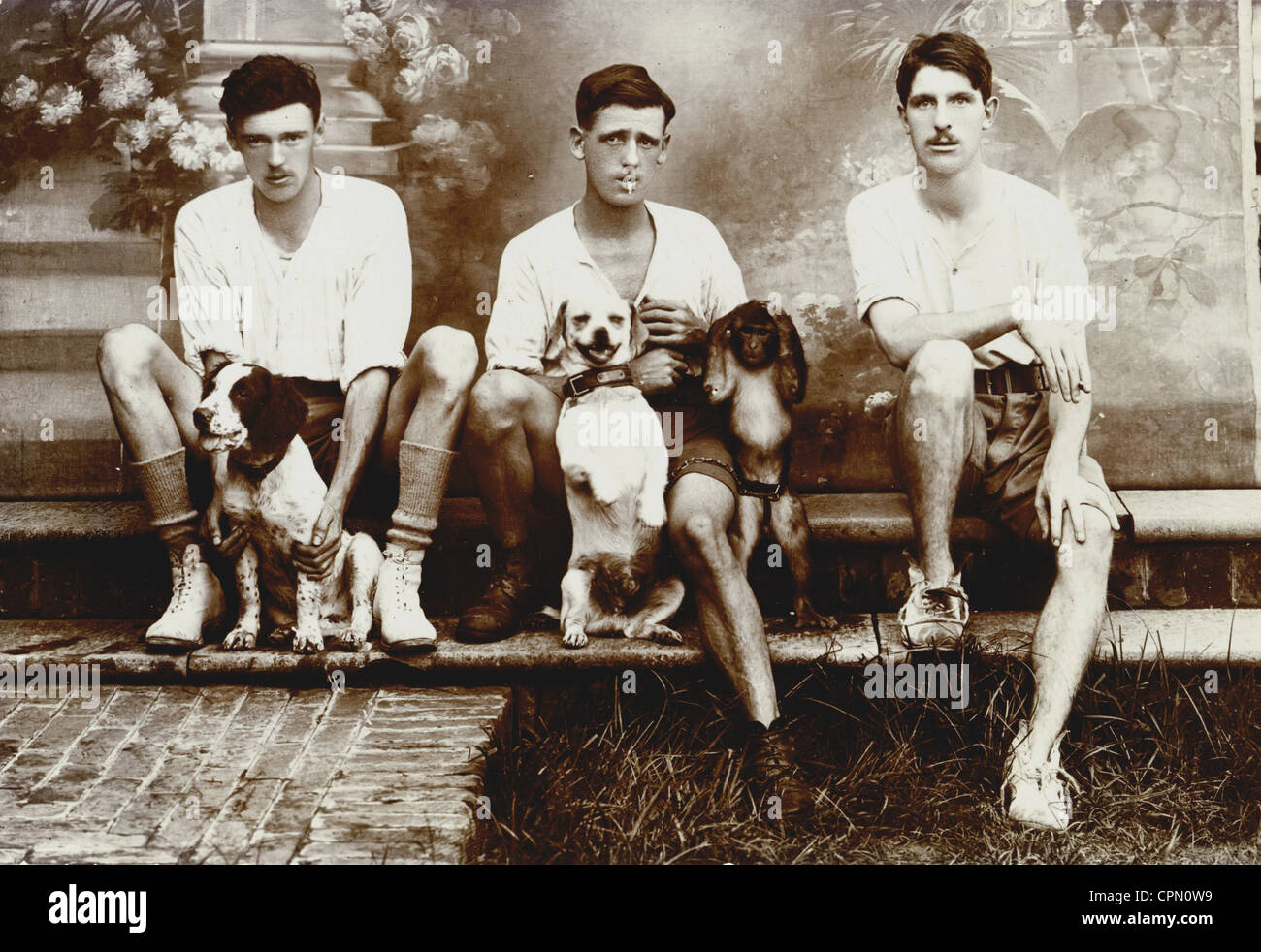 Three Handsome Young Men & their Pets Stock Photo