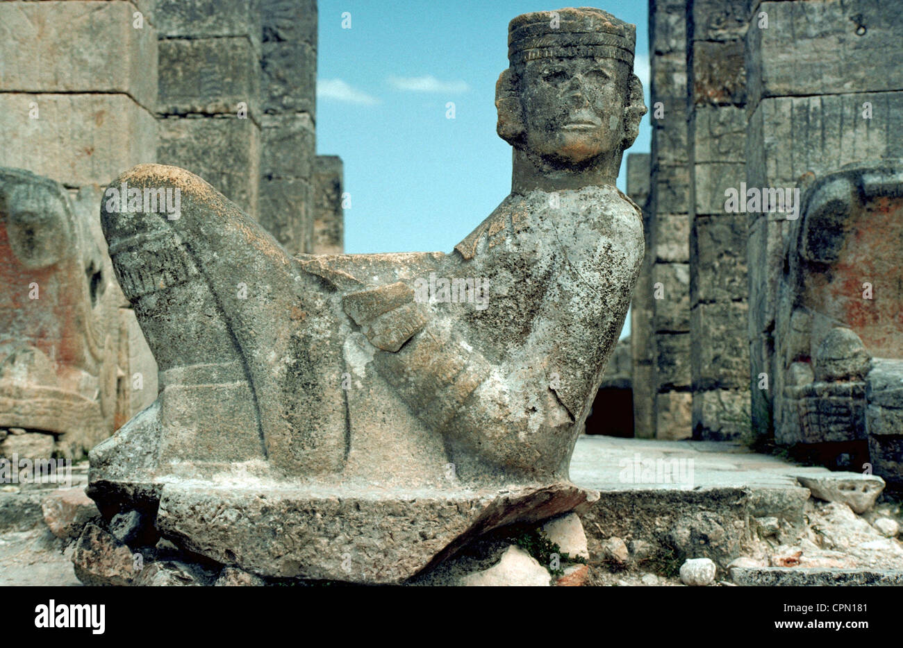 A famous stone statue of ChacMool looks out from atop the Temple of