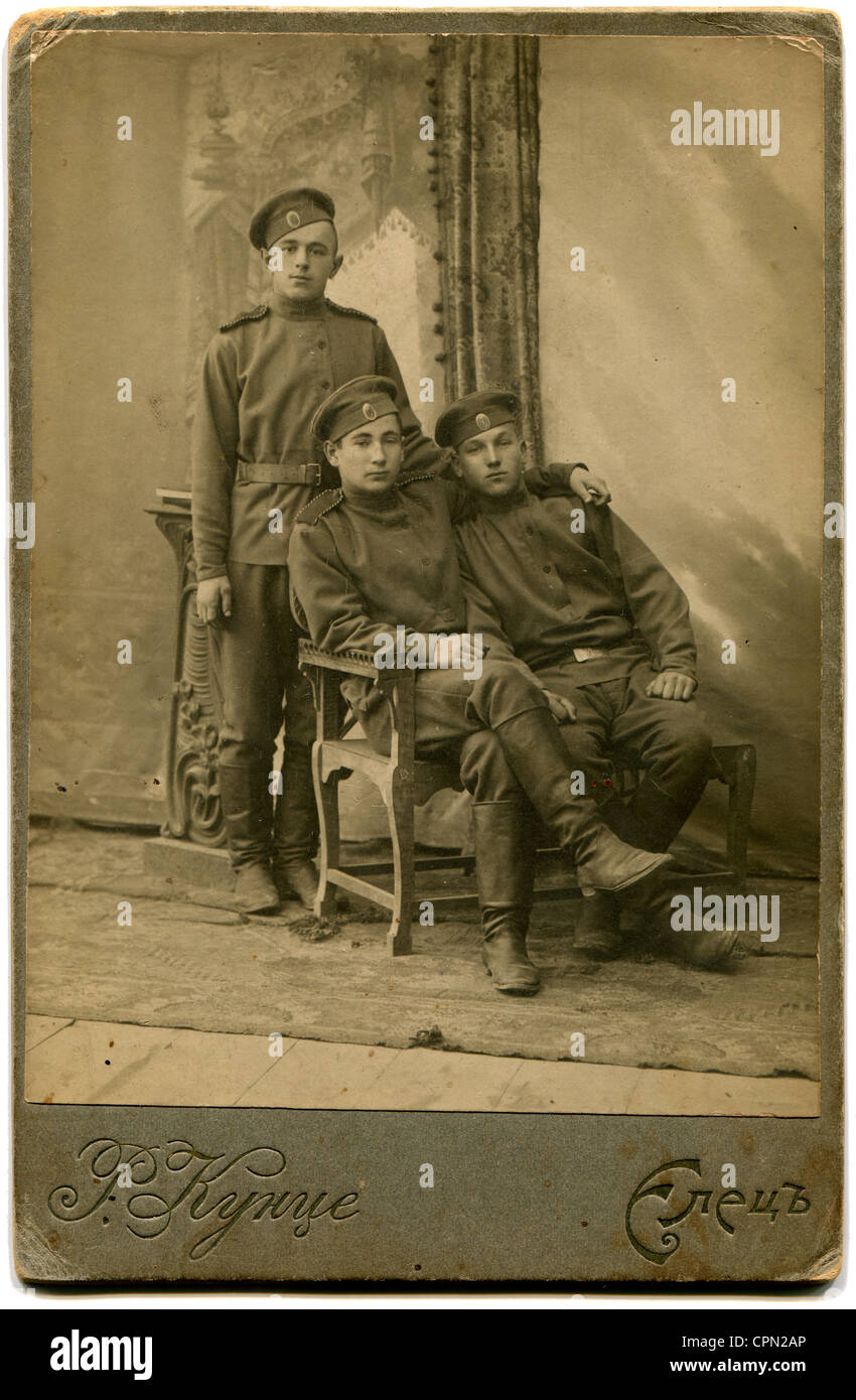 An antique photo shows Three soldiers in field uniform Stock Photo - Alamy