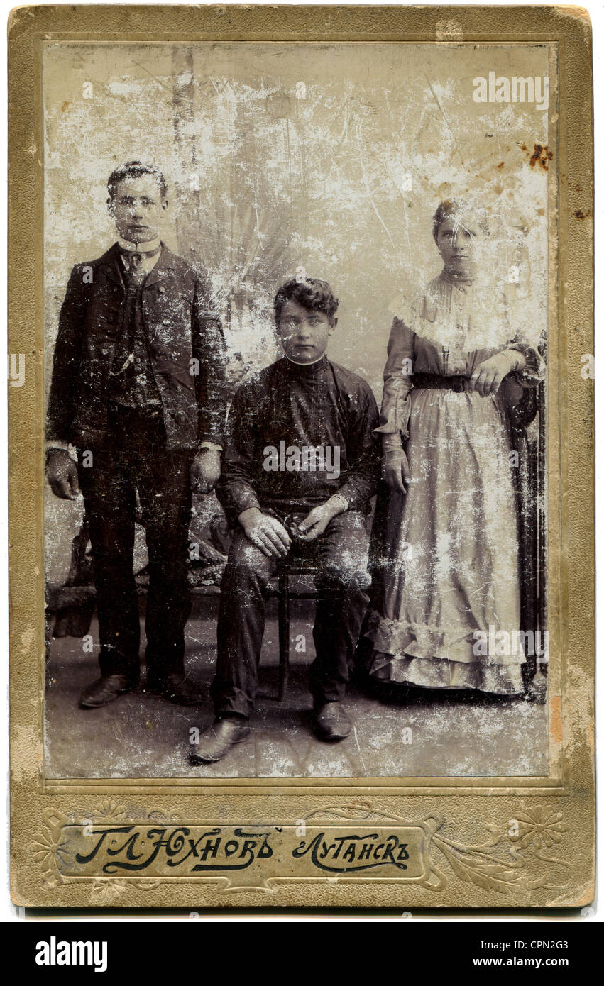 An antique photo shows Two men and a woman Stock Photo - Alamy