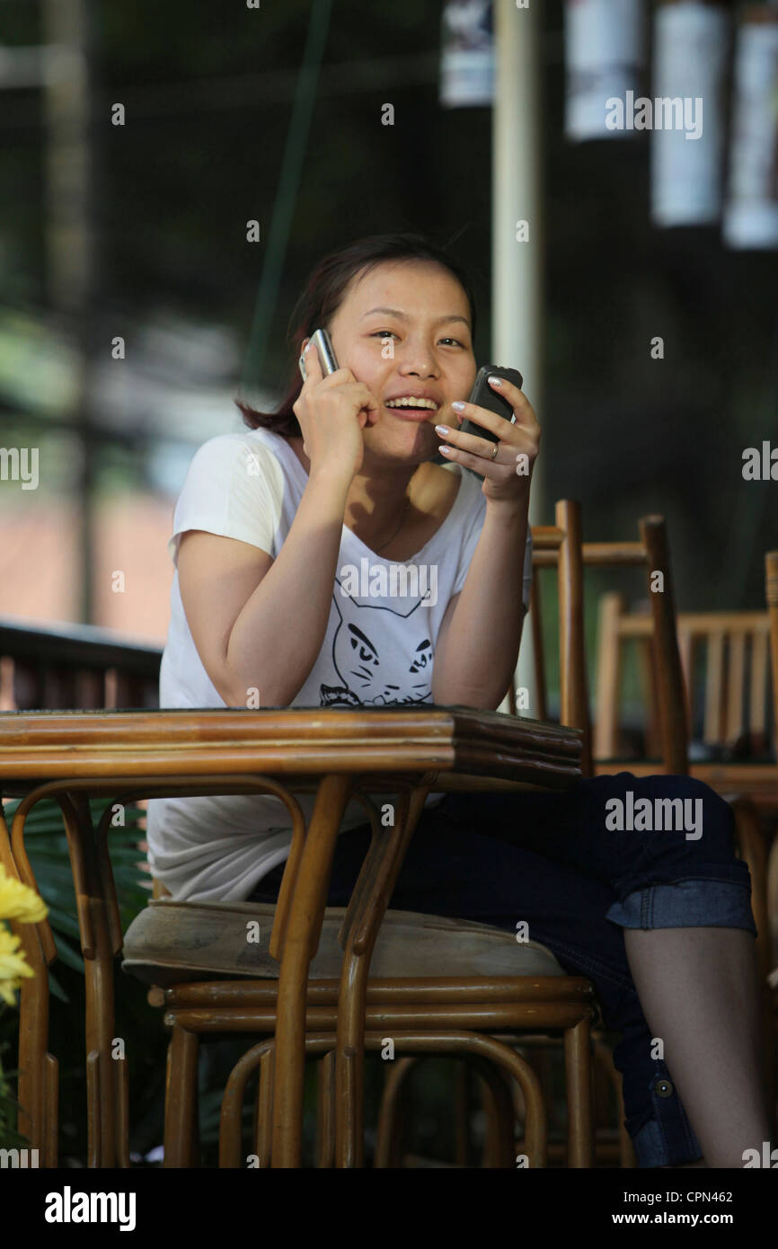 Female asiatic woman sitting on hi-res stock photography and images - Alamy