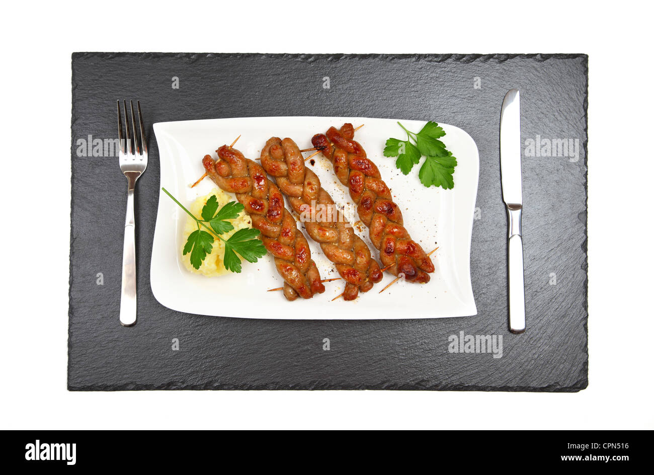 Bratwurst - fried sausage with mashed potatoes - top view Stock Photo