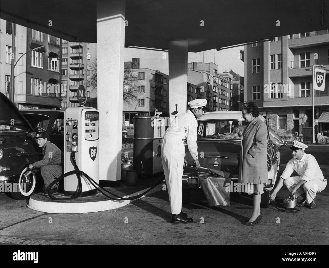 transport / transportation, car, petrol station, BP petrol station, filling station attendant is helping customer during the refuelling of her car, West Berlin, Germany, circa 1960, Additional-Rights-Clearences-Not Available Stock Photo