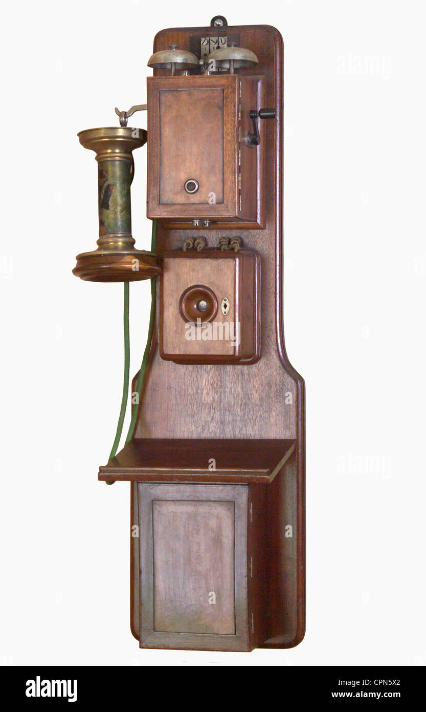 technology,telephone,one of the first wall-mounted,version OB 1882,OB is the acronym for the term local battery,battery provided the electric power for the integrated microphone of the American Blake Company,still only four copies existing,Germany,1882,exhibit at telephone museum Morbach,microphone,microphones,public telephone,wooden chassis,wooden case,wood,wooden,very early telephone,wall-mounted device,telephone,phone,telephones,phones,telephone receiver,telephone receivers,invention,inventions,rarity,rarities,engineering,techno,Additional-Rights-Clearences-Not Available Stock Photo