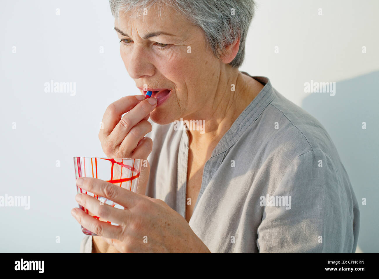 ELDERLY PERSON TAKING MEDICATION Stock Photo Alamy