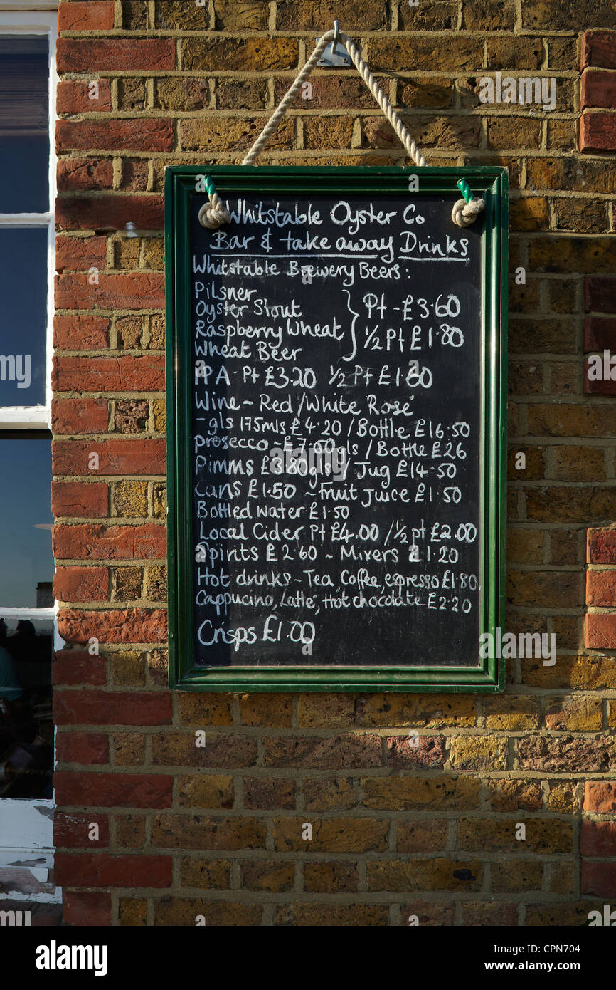 The menu for "The Whitstable Oyster Company" hanging on the wall
