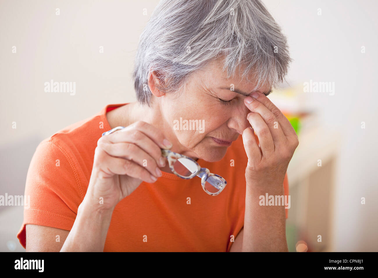 TIRED ELDERLY PERSON Stock Photo