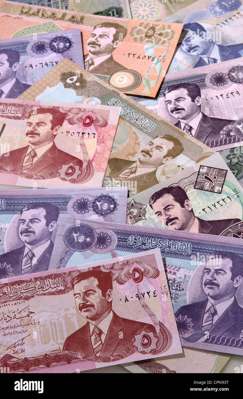 money / finances, banknote, Iraq, dinar, Iraqi banknote with the portrait of Saddam Hussein, dictator, dictators, currency, currencies, valuta, Iraqi dinar, symbol, symbols, symbolic, symbolical, symbol image, economy, Iraqi, several, pile of money, personality cult, banknote, bank note, bill, bank notes, historic, historical, Additional-Rights-Clearences-Not Available Stock Photo