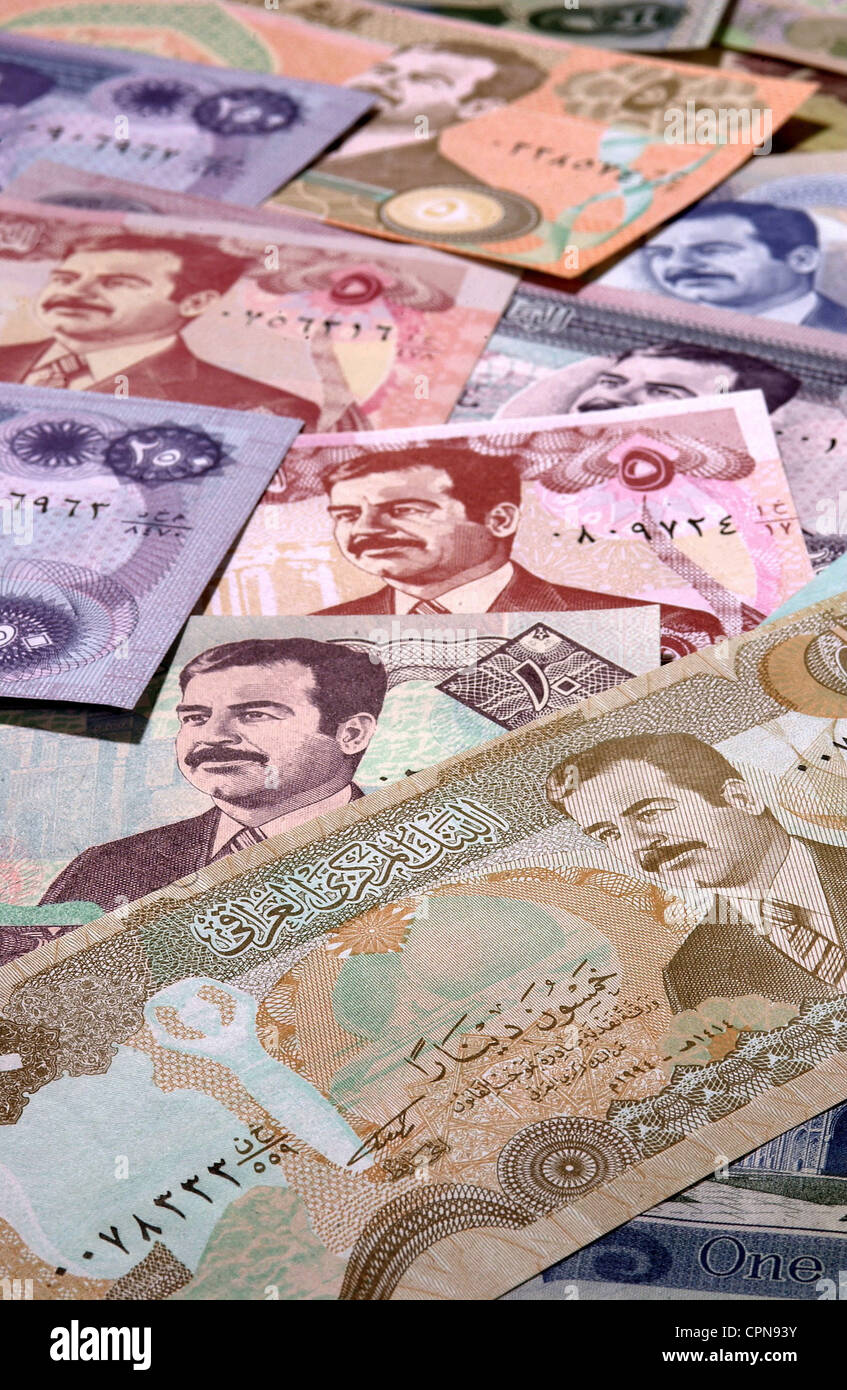 money, banknote, Iraq, dinar, Iraqi banknotes with the portrait of Saddam Hussein, currency, currencies, valuta, Iraqi, dinar, symbolic, symbolical, symbol image, economy, dictator, dictators, pile of money, personality cult, banknote, bank note, bill, bank notes, image, images, historic, historical, Additional-Rights-Clearences-Not Available Stock Photo