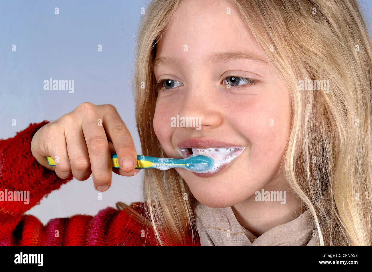 cosmetics, dental care, girl is cleaning tooth with a tooth-brush, Germany, Additional-Rights-Clearance-Info-Not-Available Stock Photo