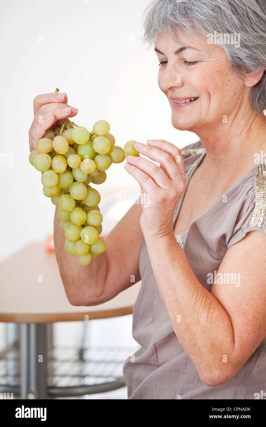 ELDERLY PERSON EATING FRUIT Stock Photo - Alamy
