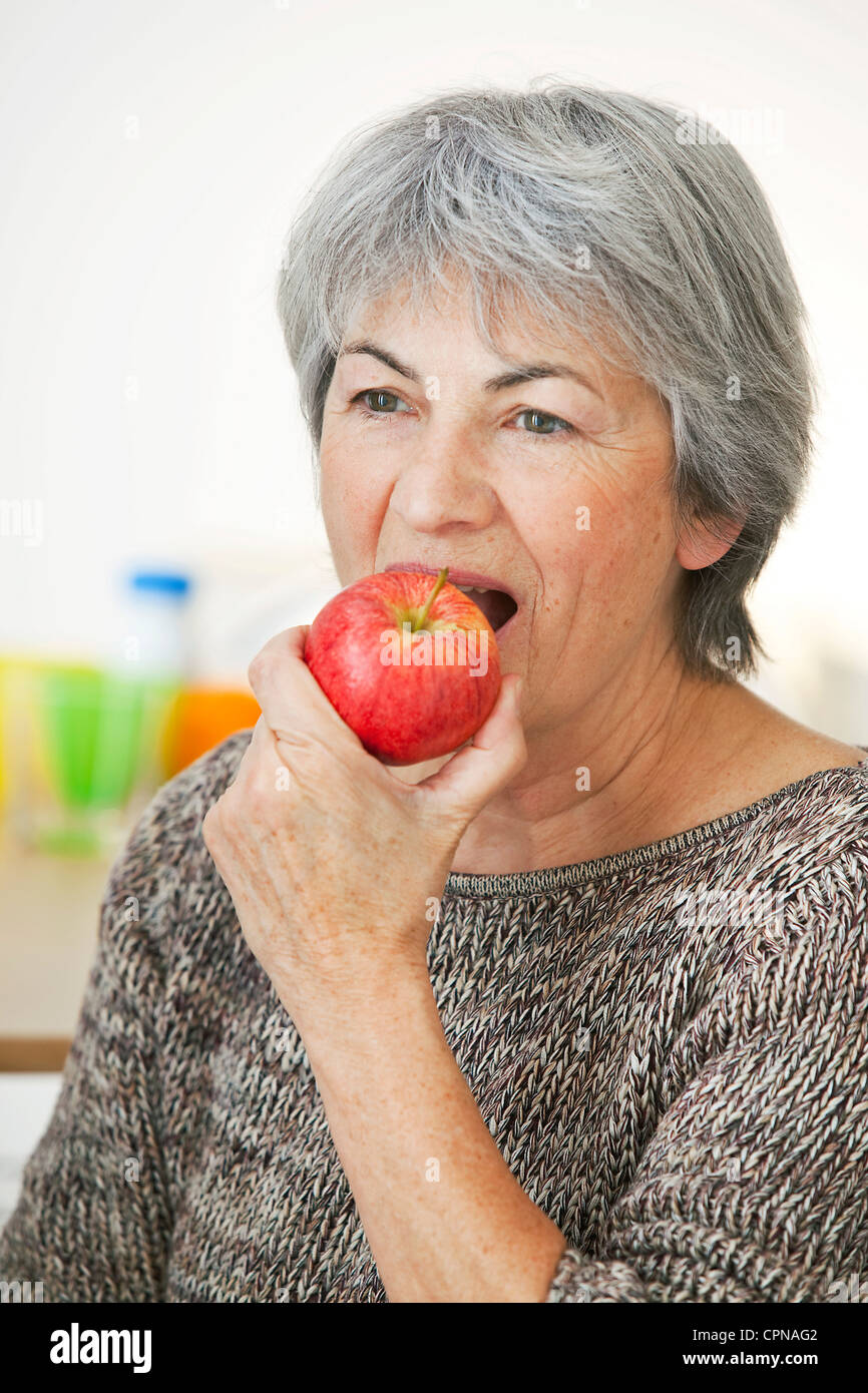 ELDERLY PERSON EATING FRUIT Stock Photo Alamy
