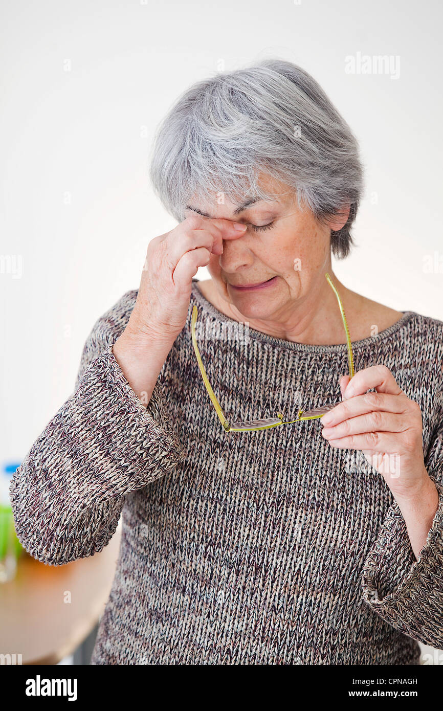 TIRED ELDERLY PERSON Stock Photo