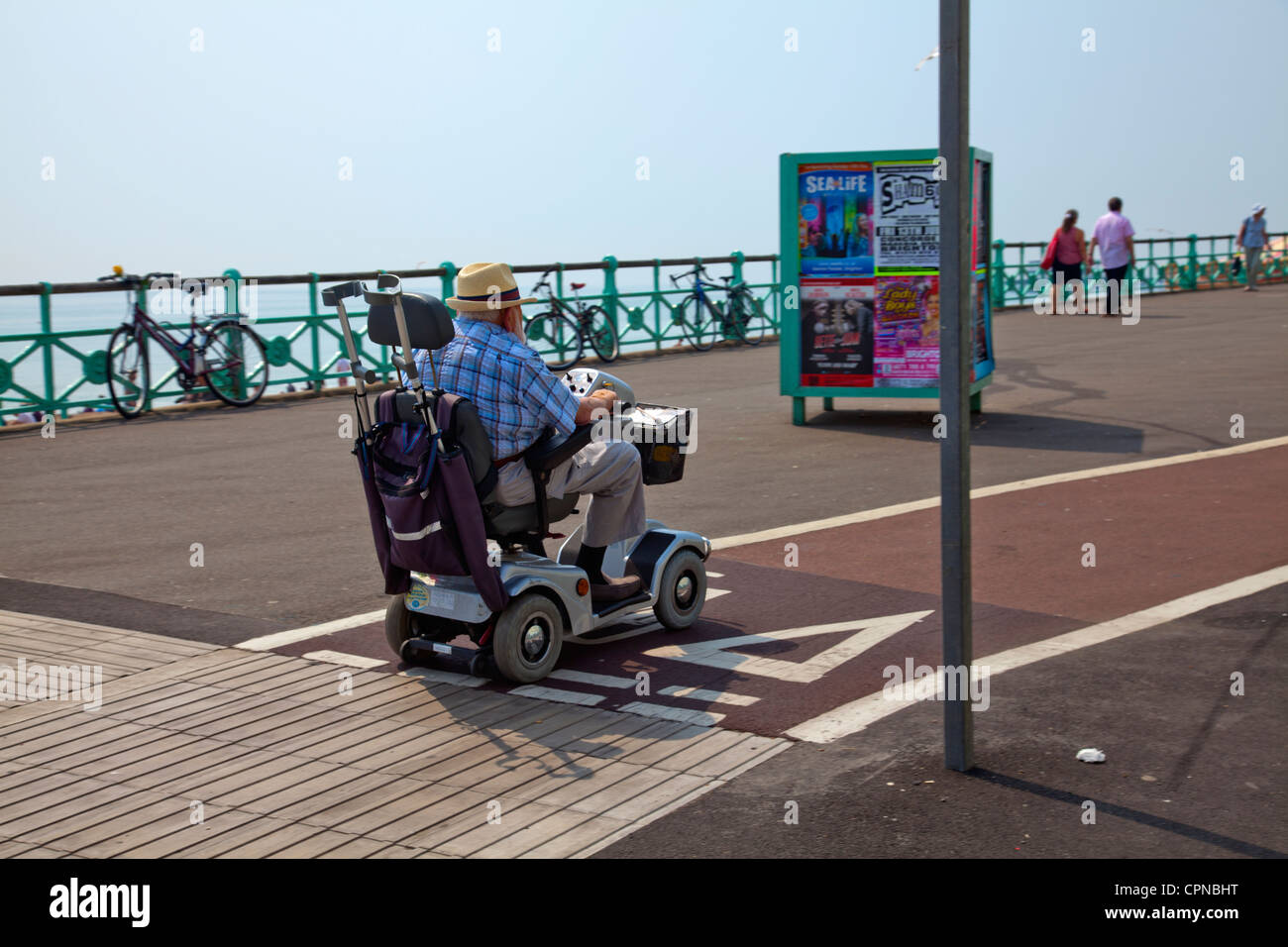 Man on Mobility Scooter on Brighton Promenade UK Stock Photo Alamy
