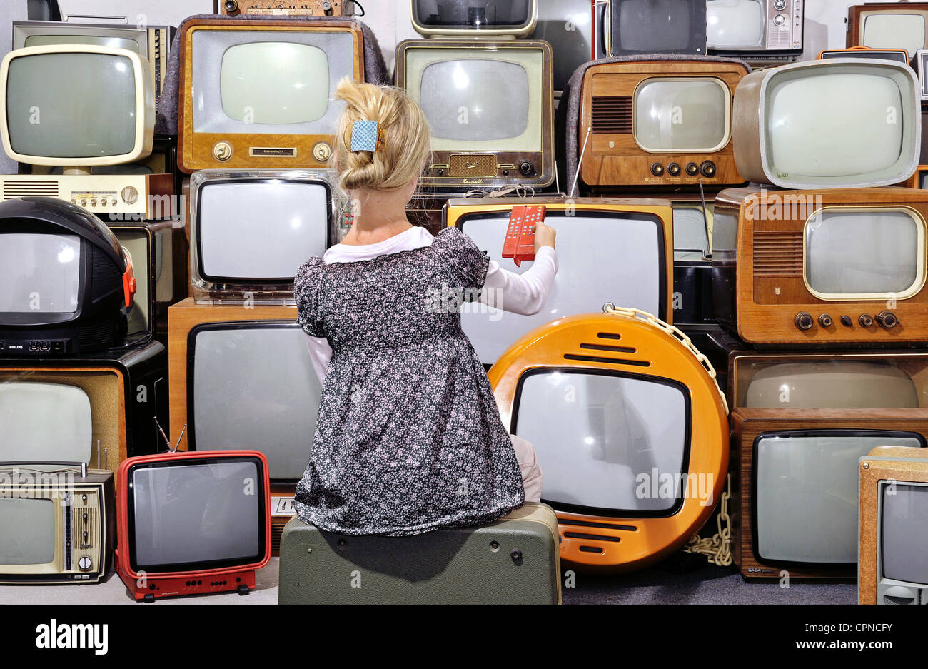 broadcast, television, girl with television sets of the 50s years up to 70s years, symbol image, Germany, Additional-Rights-Clearance-Info-Not-Available Stock Photo