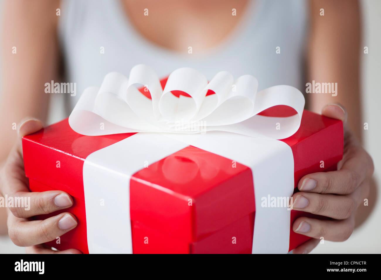 Woman holding gift box, cropped Stock Photo