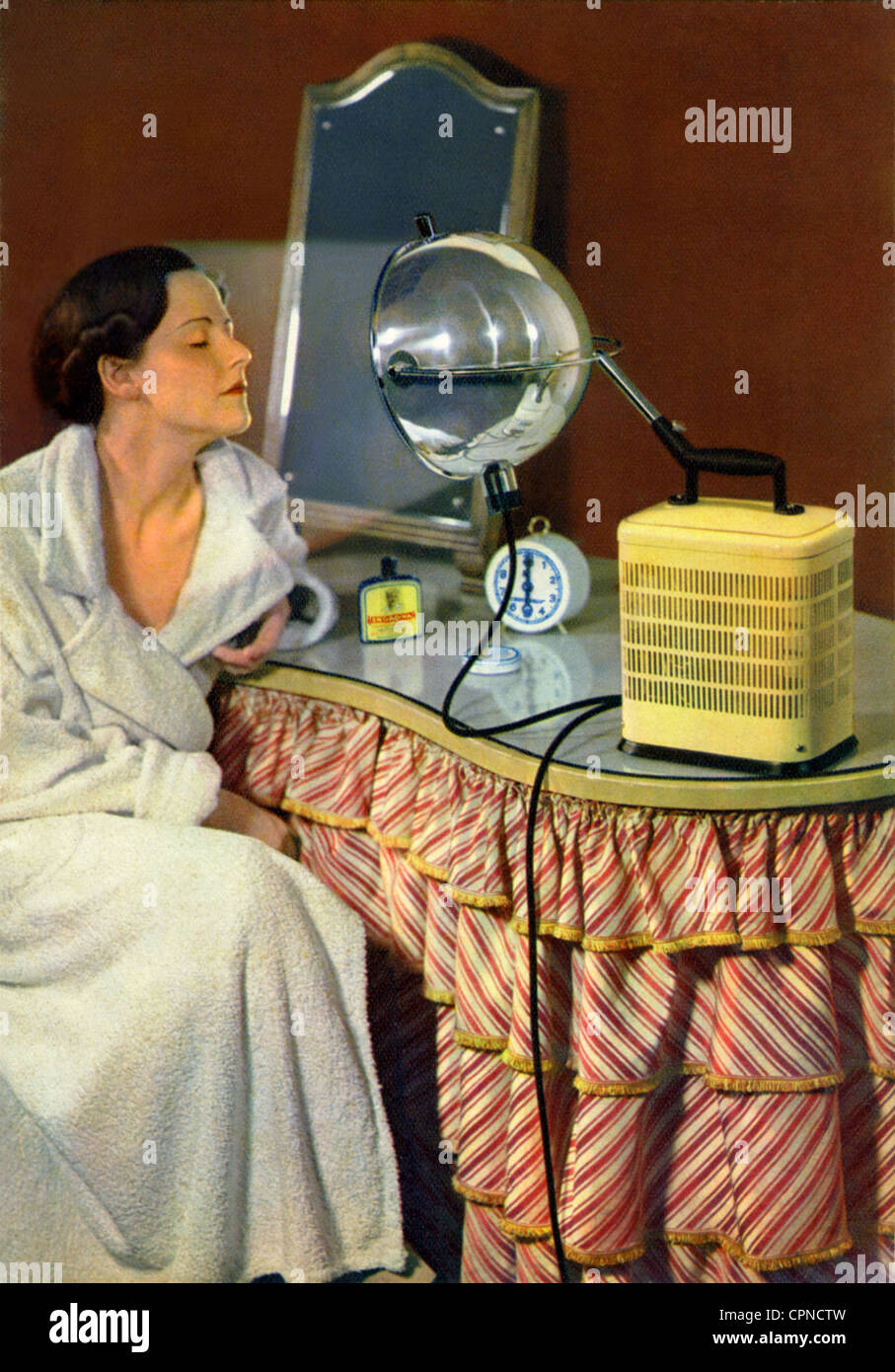 cosmetics, sun lamp, woman with sun lamp, made by: quartz lamp Ltd. Hanau,  for prophylaxis against diseases and used as cure, to strenghten body's  defences of the body, Germany, 1937, Additional-Rights-Clearences-Not  Available