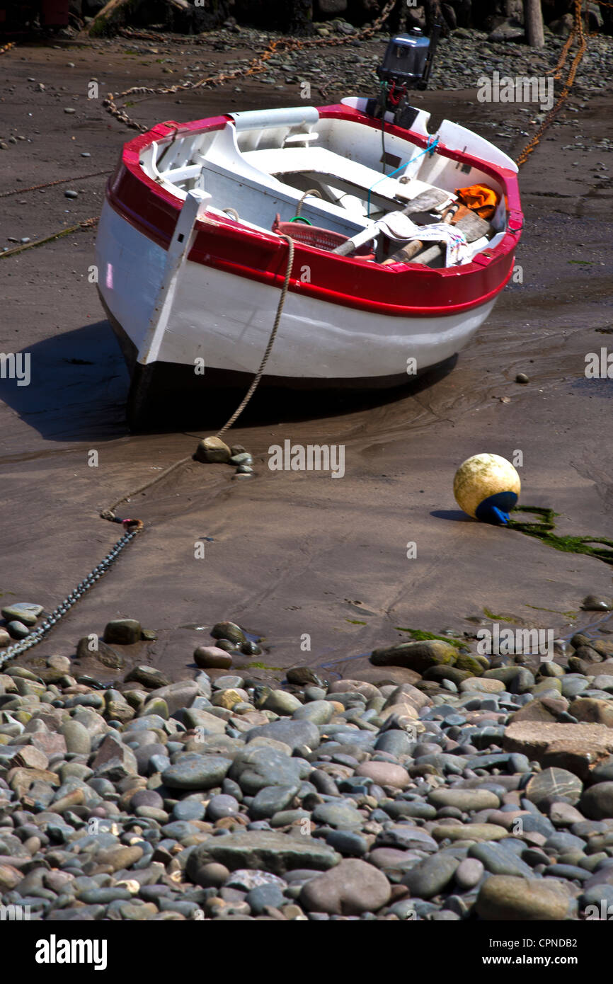 Single Fishing Boat Lying Idle at Low Tide in Harbour at Clovelly in North Devon Stock Photo Alamy