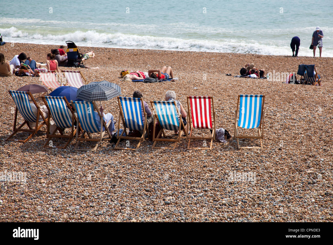 Row of Deckchairs on Brighton Beach UK Stock Photo Alamy