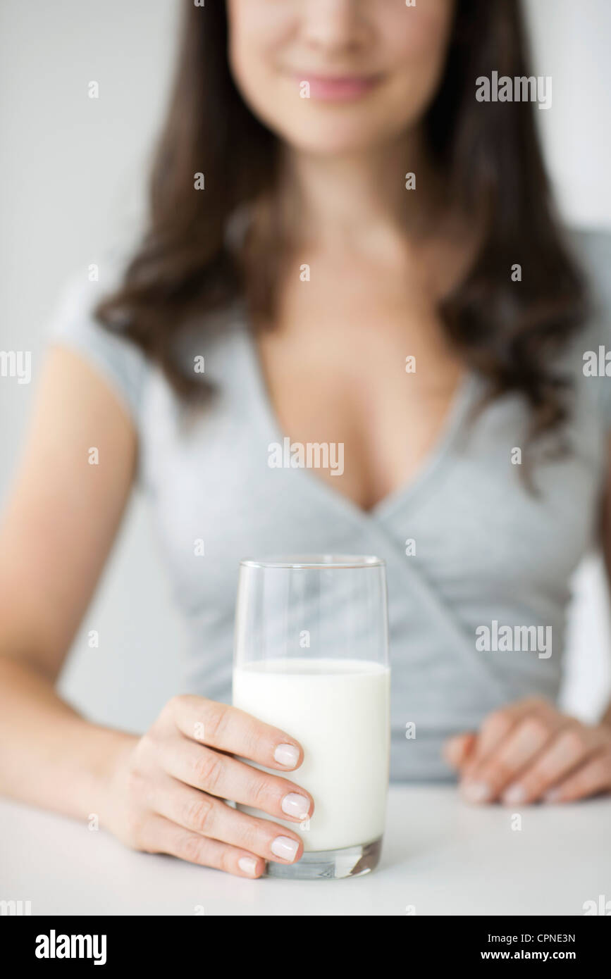 Woman holding glass of milk Stock Photo
