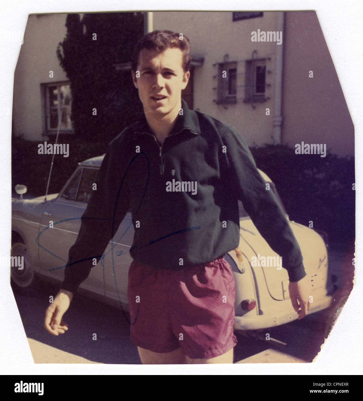 Beckenbauer, Franz, * 11.09.1945, German athlete,  (footballer) , half length, early private photograph, as circa 17 years old boy, before starting his professional career, on a  street in front of a Lloyd 600 car, photograph with original autograph, Munich, circa 1962, Stock Photo