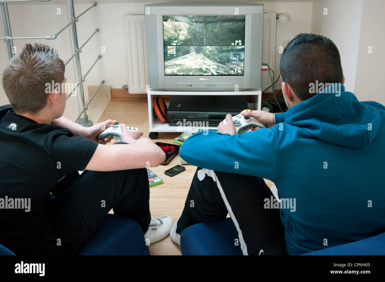 ADOLESCENT PLAYING VIDEO GAME Stock Photo Alamy
