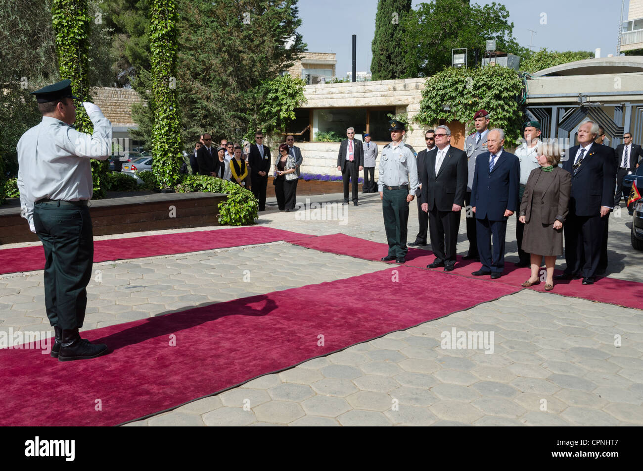 Israeli President Shimon Peres and his German counterpart Joachim Gauck review a military honour guard during a welcom ceremony Stock Photo