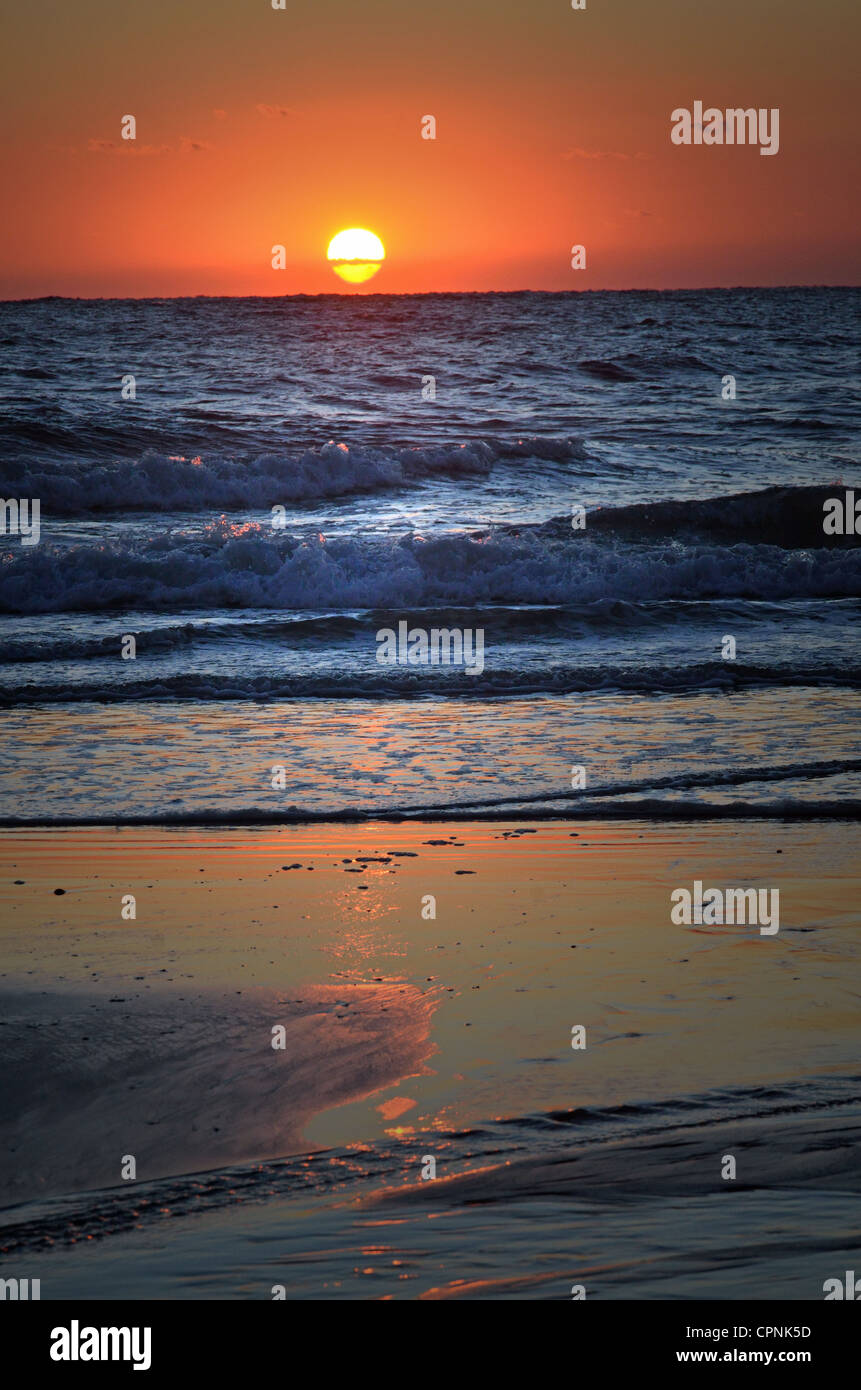 A winter's sunrise at Fernandina Beach by Jackie DeBusk Stock Photo