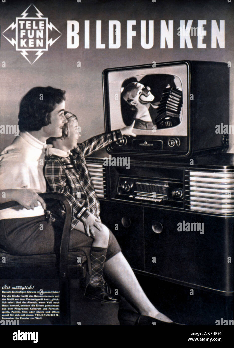 broadcast, television, mother and daughter sitting together in front of the television set, child pointing enthusiastic towards the television picture with clown, cover picture the Telefunken magazine 'Bildfunken', advertising for new television set FE 10 T, tabletop unit with 43 centimeter screen size, original price 1954: DM 998, Germany, 1954, Additional-Rights-Clearences-Not Available Stock Photo