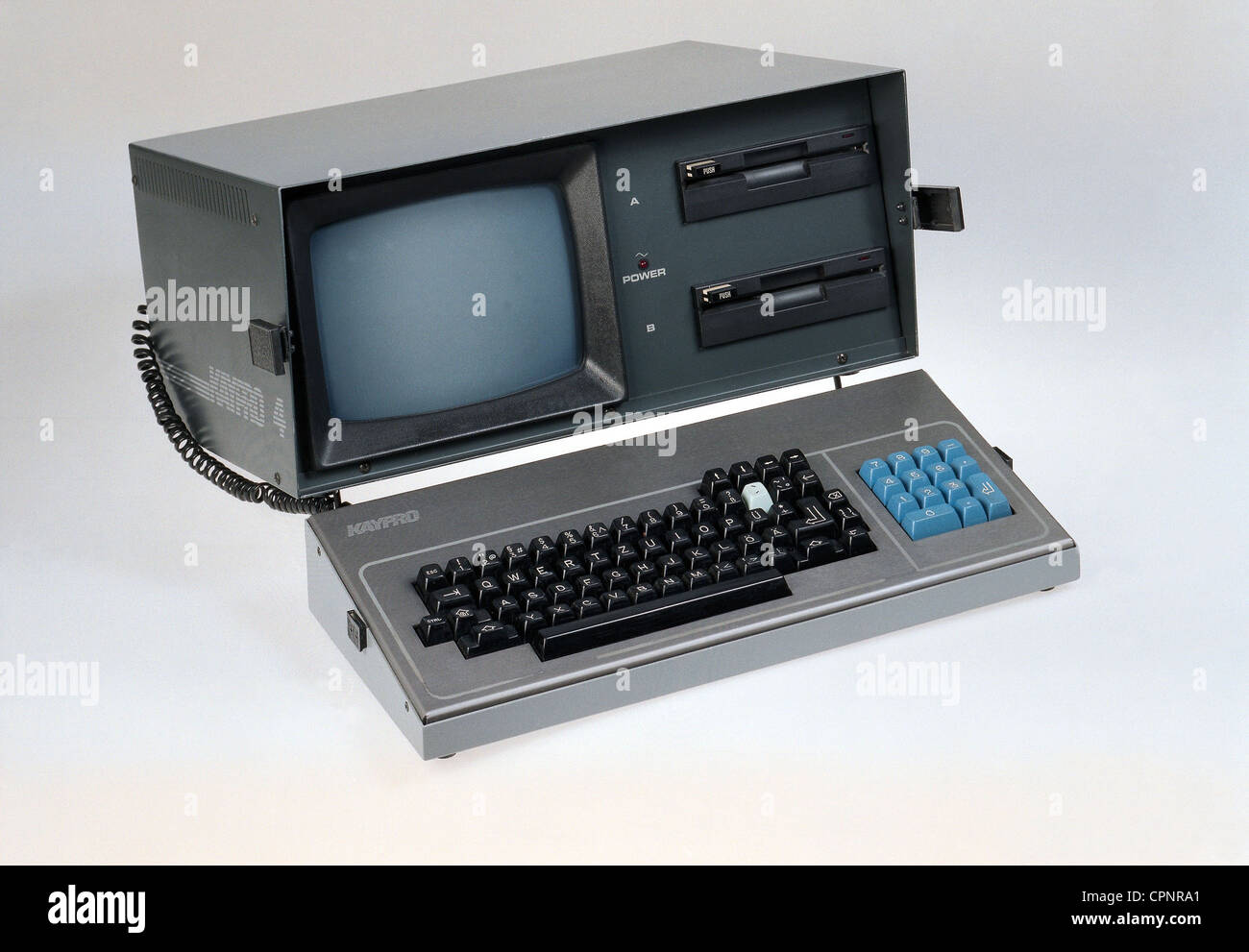 computing / electronics,computer,portable personal computer,Kaypro 4,one of the first portable computer,made by: Kaypro Corporation,USA,1983,portable,personal computer,laptop,laptop computer,laptops,laptop computers,Z80 / 8 bit microprocessor,operating system CP/M,working memory 64 kilobyte,integrated 9 inch monitor with diagonal of 23 centimeter,two 5.25 inch floppy disc drives,floppy disc station,Floppy Disc,keyboard as casing cover,metal housing,weight circa 15 kilogram,original price 1984 in Germany: DM 6.898.-,history of computer,,Additional-Rights-Clearences-Not Available Stock Photo