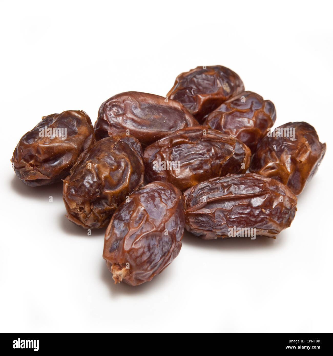 Dried Medjool dates isolated on a white studio background. Stock Photo