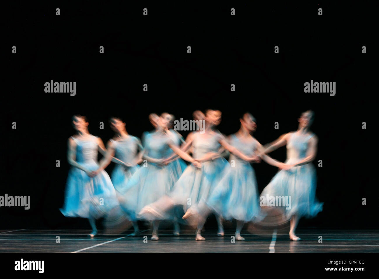Ballet dancers perform on stage. Stock Photo