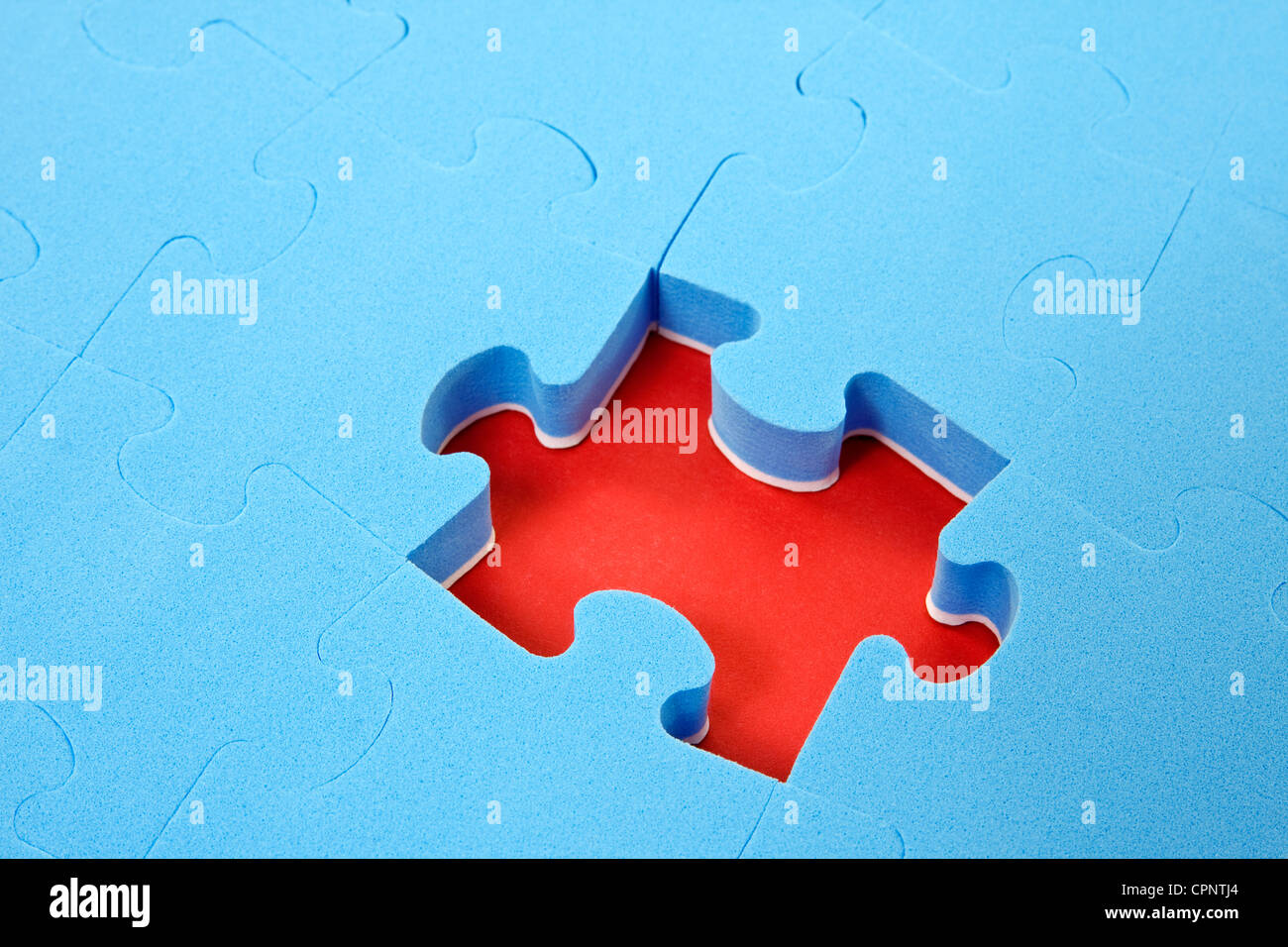 blue puzzle background with one piece missing Stock Photo - Alamy