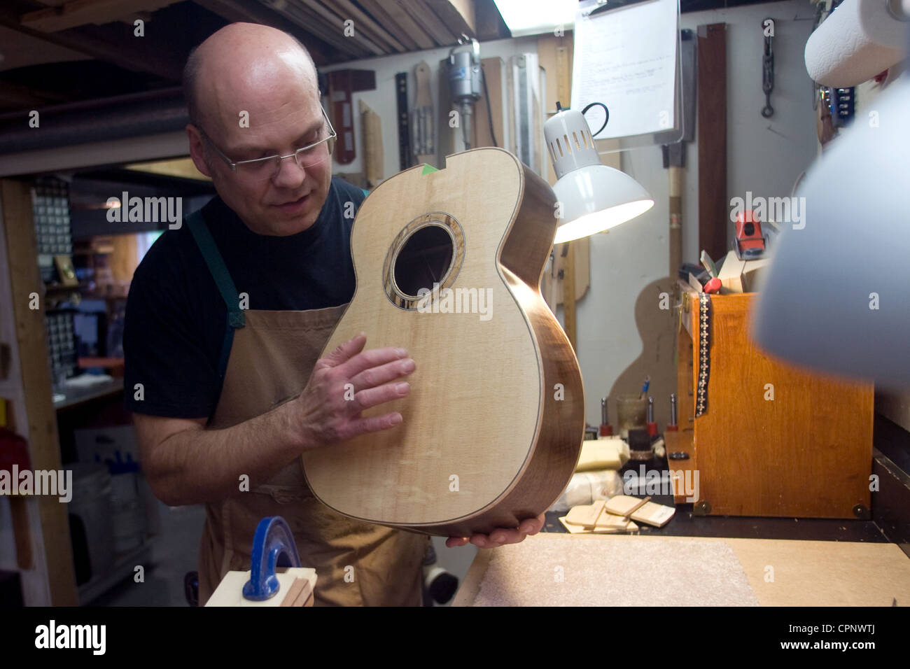 St. Thomas Ontario, Canada. John LaCroix of Lacroix Guitars custom builds guitars that sell between $3000 to $10,000. Stock Photo