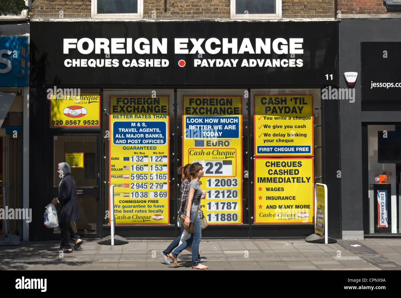 high street shop providing payday advances, loans, cheque cashing and foreign exchange, ealing, london, england Stock Photo
