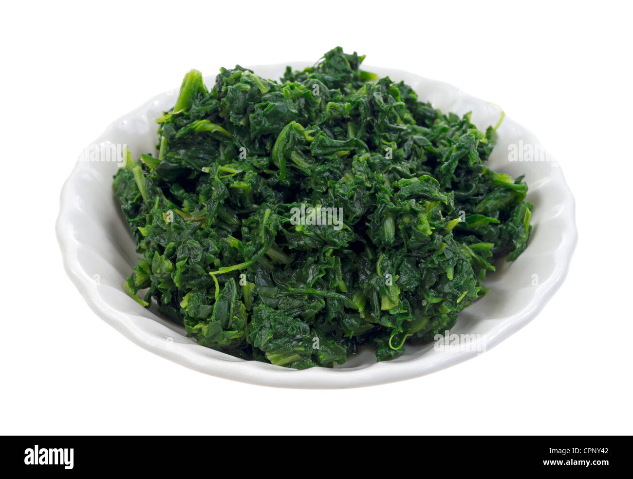 Small serving of chopped spinach in bowl Stock Photo