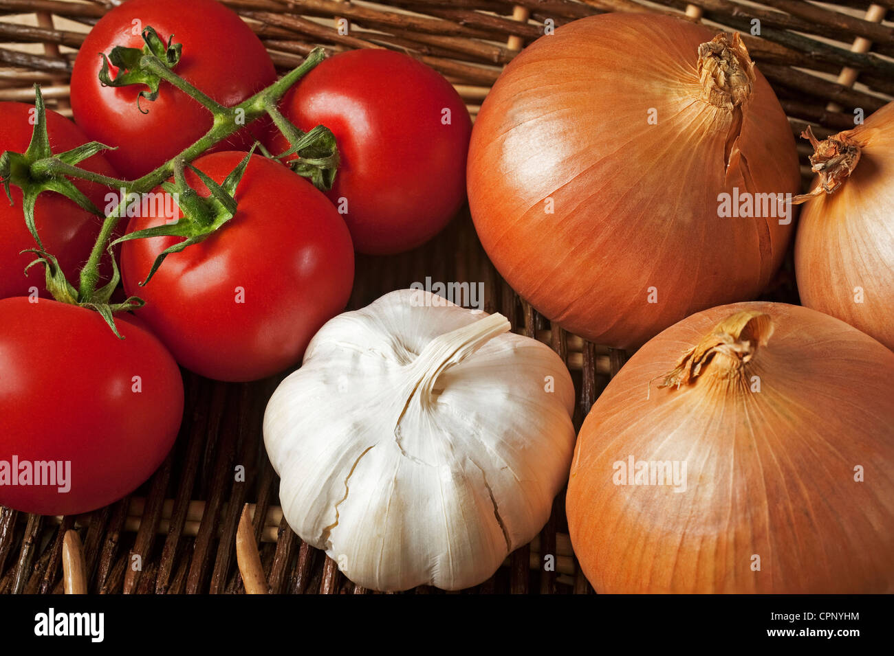 The most important ingredients in any Mediterranean recipe - tomatoes, onions and garlic Stock Photo