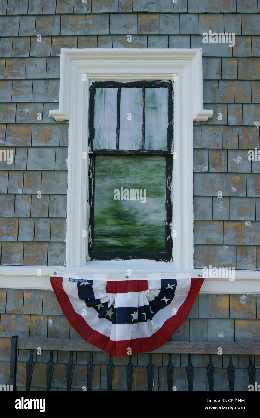 Shingle style chapel at Grove Cemetery decorated with American flag bunting on May 28, 2012, Memorial Day, Belfast, Maine, USA. Memorial Day is a national holiday honoring fallen soldiers. Stock Photo