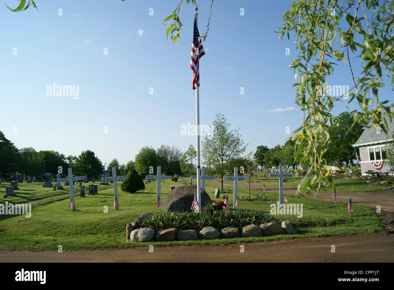World War I memorial at Grove Cemetery decorated with American Flags on May 28, 2012, Memorial Day, Belfast, Maine, USA. Memorial Day is a national holiday honoring fallen soldiers. Stock Photo