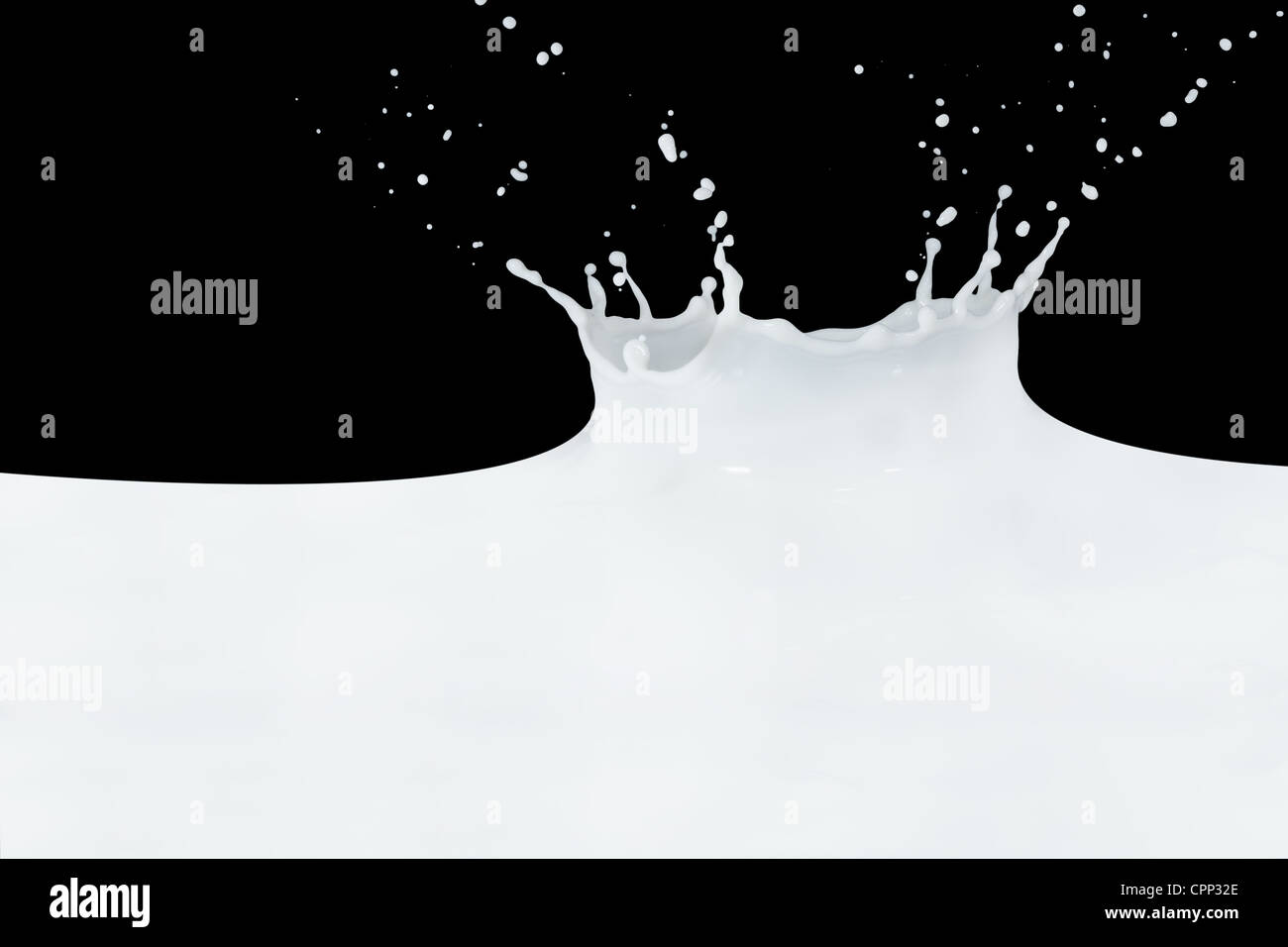 splashing milk isolated on black background Stock Photo - Alamy