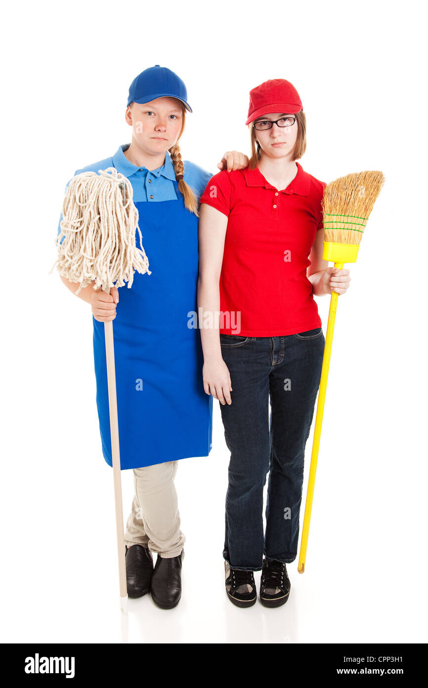 Two teenage girls or young adults working manual labor jobs and not happy about it. Full body