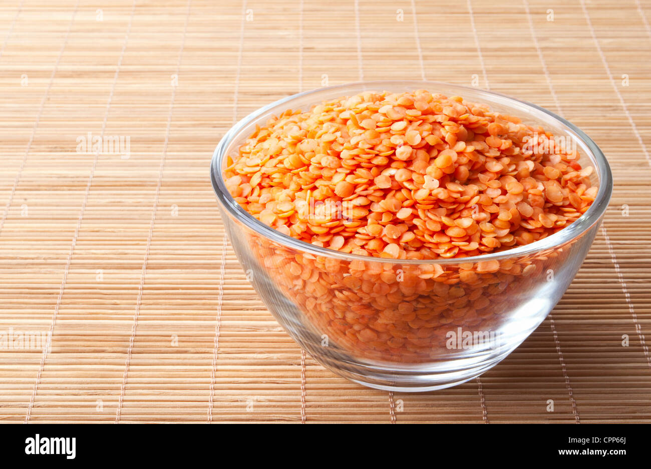 glass bowl full of red split lentils Stock Photo